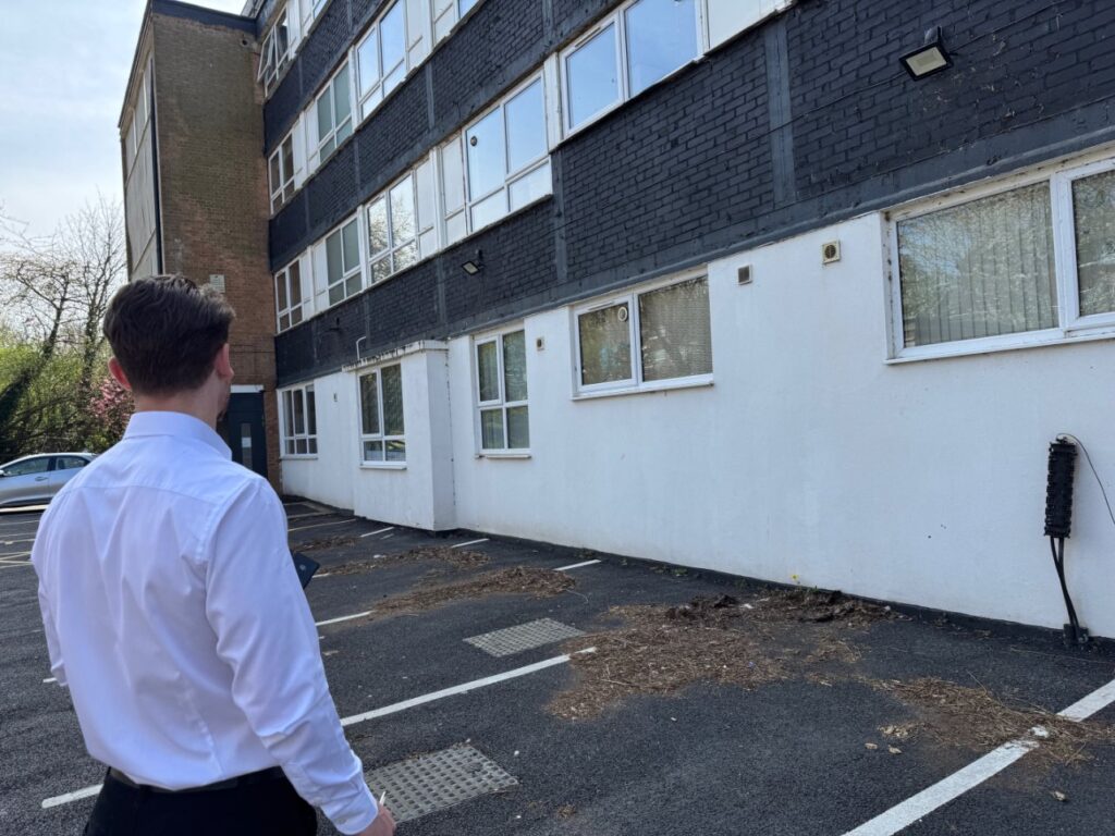 Inspecting the exterior area of a property.